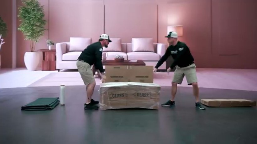 Conan Moving crew handling a piece on a DFW job