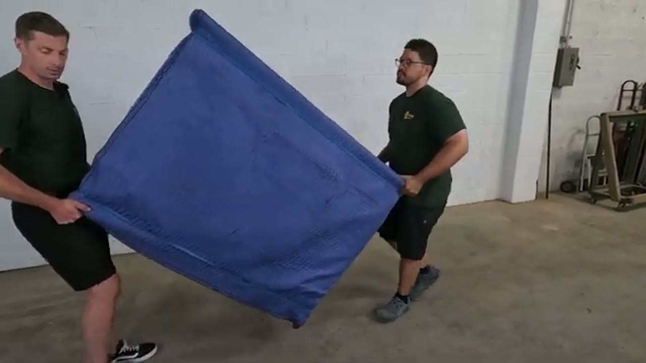 Conan Moving crew loading a truck in Haltom City, Texas